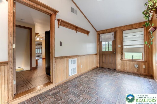 1195 Hemlock St, Lower Towamensing Tp, PA 18071 - entryway with wood walls, lofted ceiling, brick patterned flooring, a ceiling fan, and a wainscoted wall