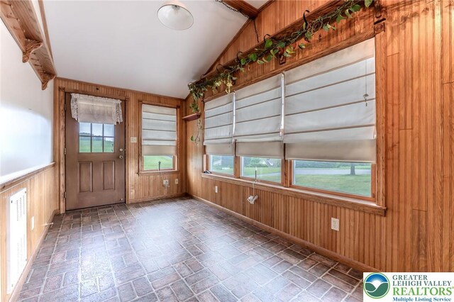 1195 Hemlock St, Lower Towamensing Tp, PA 18071 - foyer entrance featuring wood walls, vaulted ceiling, and brick patterned flooring