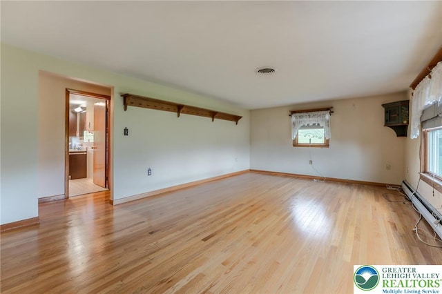 1195 Hemlock St, Lower Towamensing Tp, PA 18071 - unfurnished room with healthy amount of natural light, light wood-style floors, baseboards, and baseboard heating