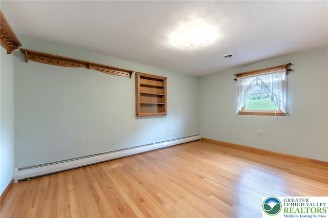1195 Hemlock St, Lower Towamensing Tp, PA 18071 - unfurnished room featuring baseboard heating, wood finished floors, and baseboards