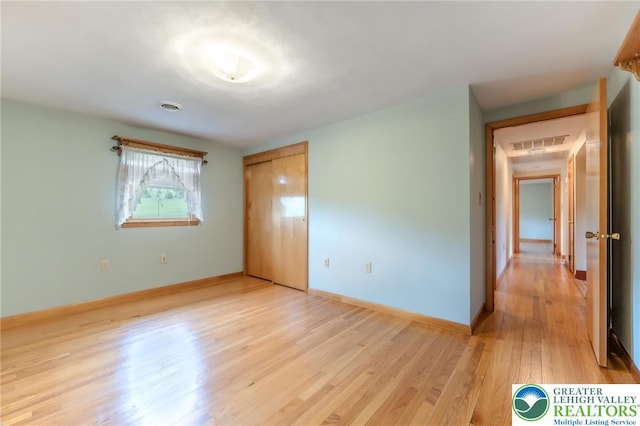 1195 Hemlock St, Lower Towamensing Tp, PA 18071 - unfurnished bedroom featuring light wood-style floors, baseboards, and a closet