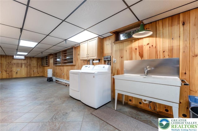 1195 Hemlock St, Lower Towamensing Tp, PA 18071 - washroom featuring wood walls, separate washer and dryer, cabinet space, plenty of natural light, and light stone finish floors