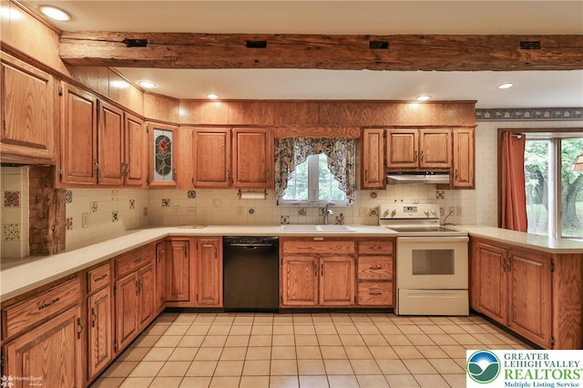 6379 Winding Rd, Upper Saucon Twp, PA 18036 - kitchen with black dishwasher, white range with electric cooktop, a sink, under cabinet range hood, and a peninsula