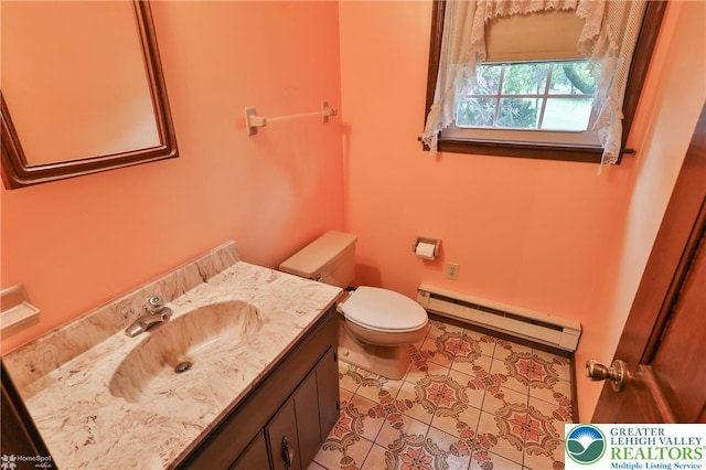 6379 Winding Rd, Upper Saucon Twp, PA 18036 - half bath with baseboard heating, toilet, vanity, and tile patterned flooring