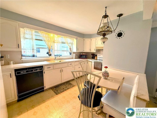 213 Main St, Pen Argyl Borough, PA 18072 - kitchen featuring black dishwasher, white electric range oven, a sink, light flooring, and light countertops