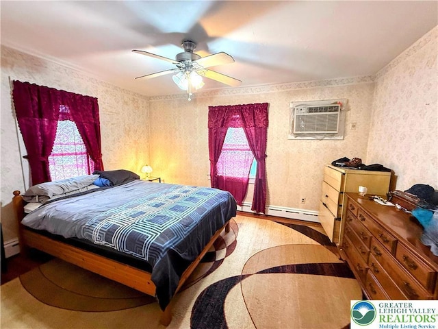 213 Main St, Pen Argyl Borough, PA 18072 - bedroom with wallpapered walls, a baseboard radiator, wood finished floors, a wall mounted AC, and ceiling fan