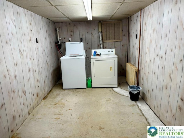 213 Main St, Pen Argyl Borough, PA 18072 - washroom featuring washing machine and dryer, radiator, and wooden walls