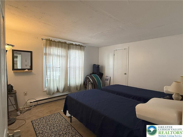 bedroom with carpet floors, a baseboard radiator, and a textured ceiling