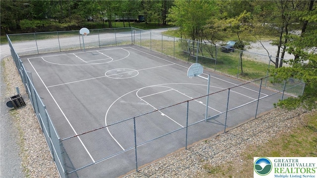 view of sport court featuring community basketball court and fence