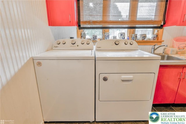 laundry room with cabinet space and separate washer and dryer