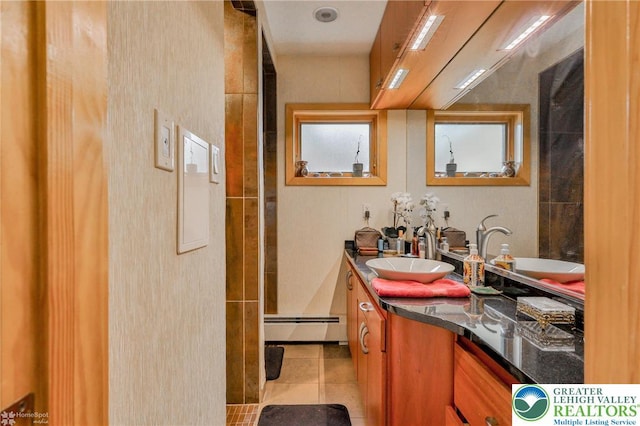 bathroom with a baseboard radiator, tile patterned floors, and vanity