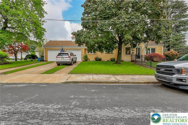 obstructed view of property with asphalt driveway and an attached garage