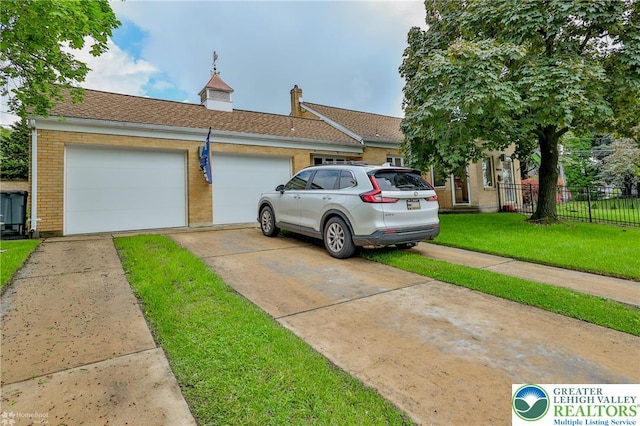 view of front of home with driveway, a garage, and brick siding