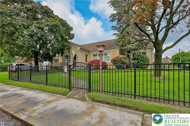 view of front of house with a gate and brick siding