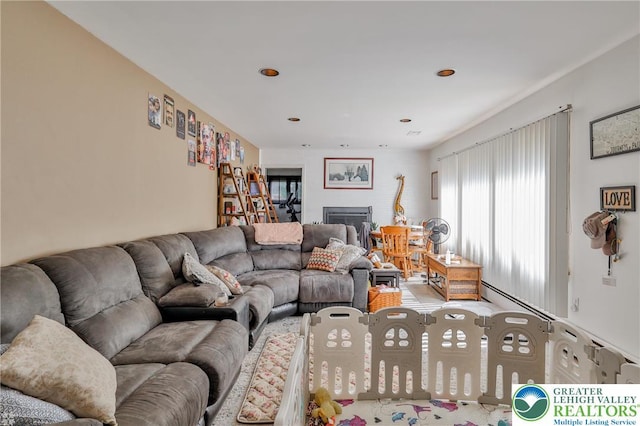 living area featuring baseboard heating