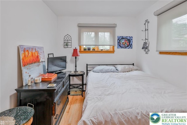 bedroom with wood finished floors
