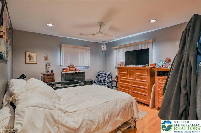 bedroom featuring light wood-style floors, recessed lighting, and ceiling fan