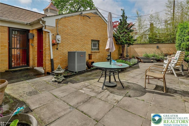 view of patio / terrace with central AC unit