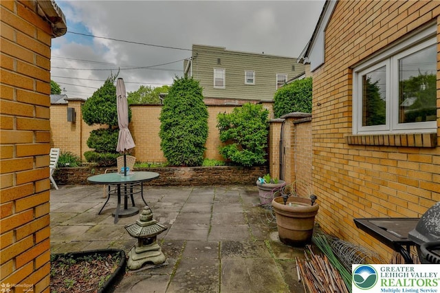 fenced backyard featuring a patio
