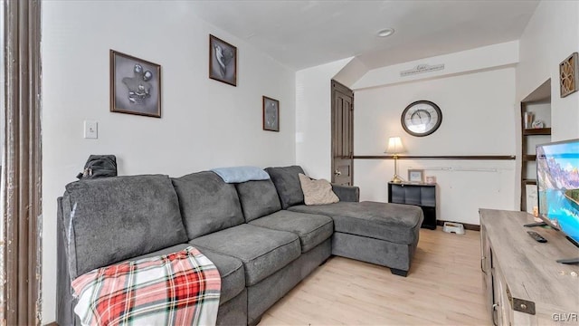 living area with light wood-style floors