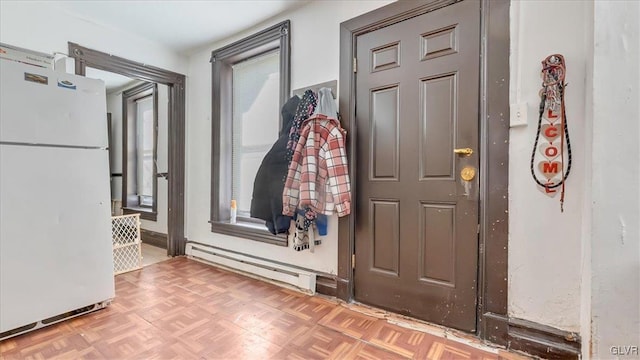 foyer entrance with a baseboard radiator