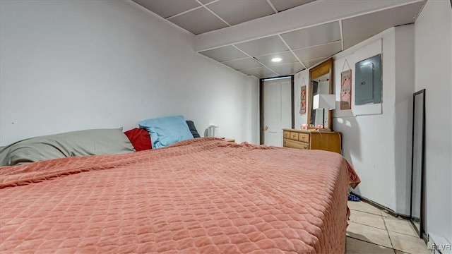bedroom featuring a paneled ceiling, electric panel, recessed lighting, and light tile patterned floors