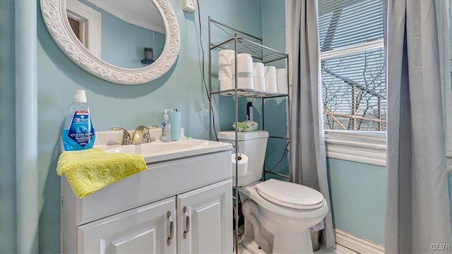 bathroom with toilet and vanity