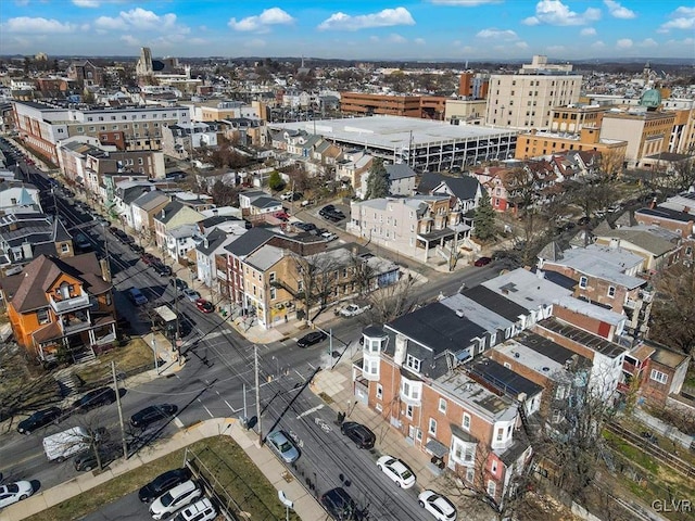 aerial view of property and surrounding area featuring nearby urban area