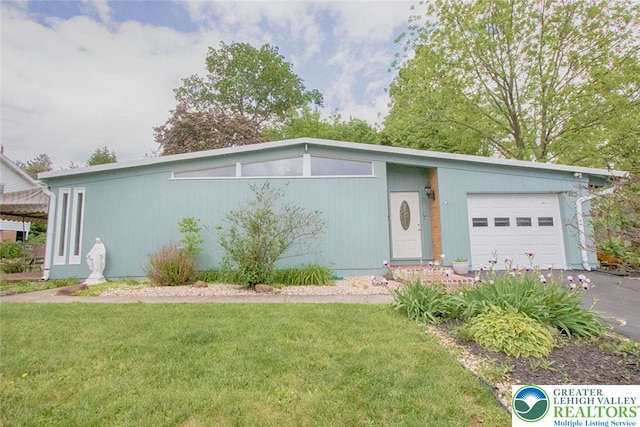 1115 N 38th St, South Whitehall Twp, PA 18104 - mid-century modern home with an attached garage, a front yard, and driveway