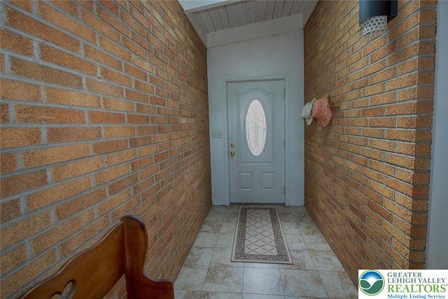 1115 N 38th St, South Whitehall Twp, PA 18104 - doorway featuring brick wall and wood ceiling