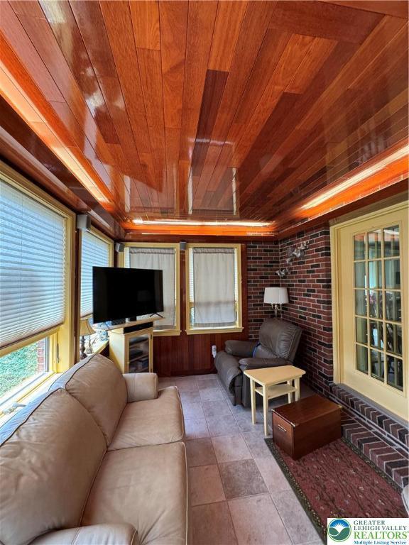 1472 Bearcat, Cove, PA 17922 - living area with wood ceiling and brick wall
