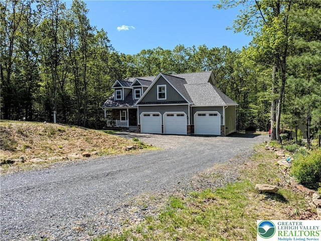 130 Corktree Rd, Polk Twp, PA 18058 - view of front of house with gravel driveway and an attached garage