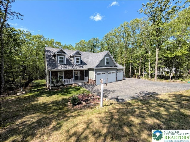 130 Corktree Rd, Polk Twp, PA 18058 - cape cod house with a porch, driveway, and a front lawn