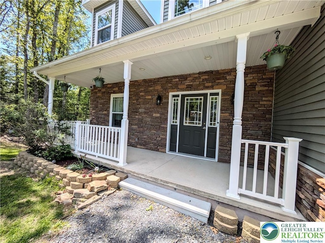 130 Corktree Rd, Polk Twp, PA 18058 - doorway to property with a porch and stone siding