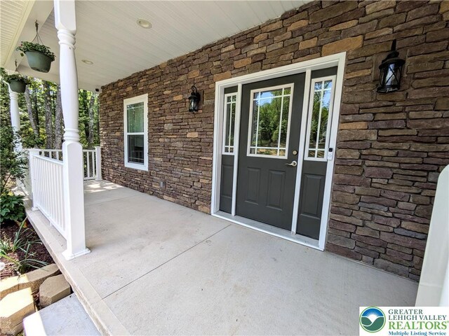130 Corktree Rd, Polk Twp, PA 18058 - entrance to property featuring a porch and stone siding