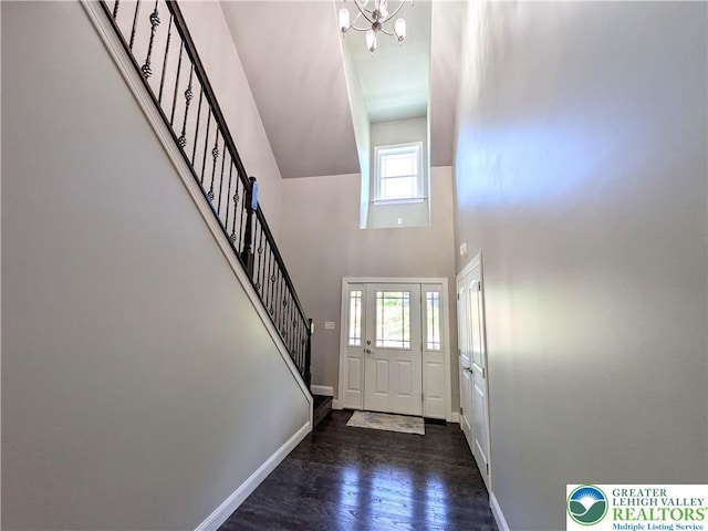 130 Corktree Rd, Polk Twp, PA 18058 - entrance foyer featuring stairway, a towering ceiling, a chandelier, baseboards, and wood finished floors
