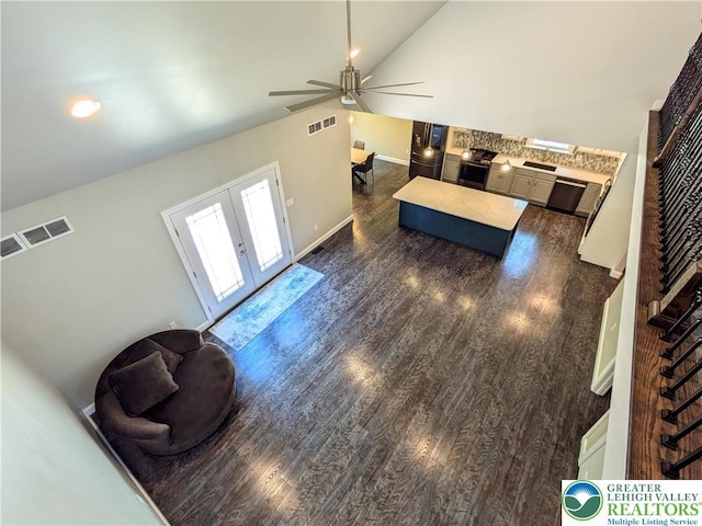 130 Corktree Rd, Polk Twp, PA 18058 - living area featuring french doors, vaulted ceiling, dark wood finished floors, ceiling fan, and baseboards