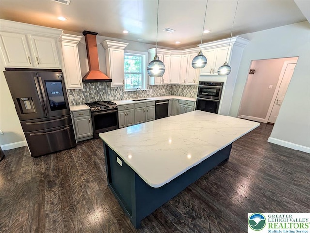 130 Corktree Rd, Polk Twp, PA 18058 - kitchen with appliances with stainless steel finishes, wall chimney exhaust hood, a sink, baseboards, and recessed lighting