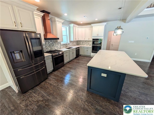 130 Corktree Rd, Polk Twp, PA 18058 - kitchen featuring stainless steel appliances, backsplash, dark wood finished floors, a center island, and wall chimney range hood