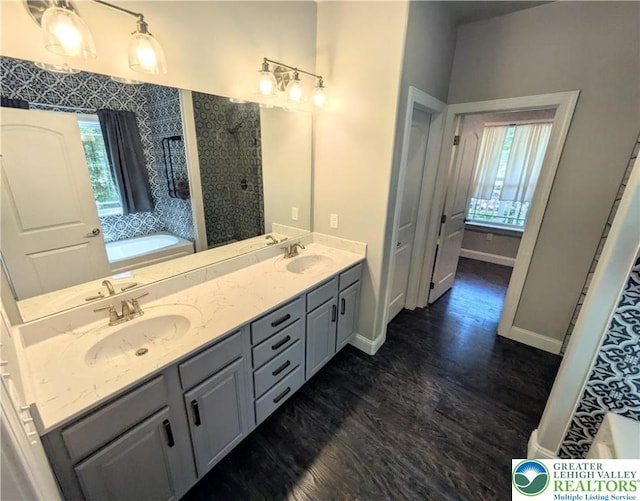 130 Corktree Rd, Polk Twp, PA 18058 - full bath featuring plenty of natural light, wood finished floors, a bath, and double vanity