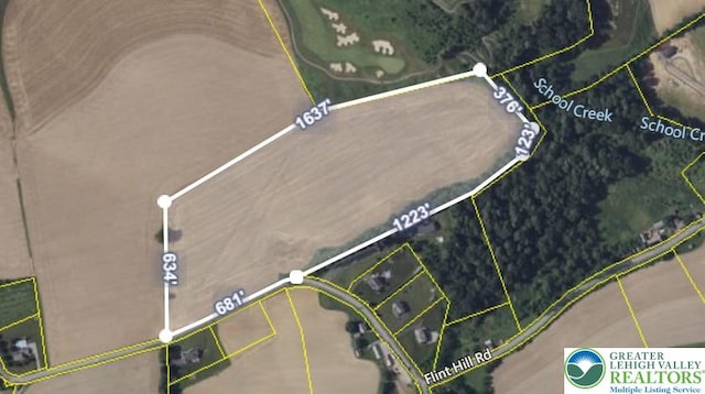 aerial map of property and surrounding area featuring property parcel outlined