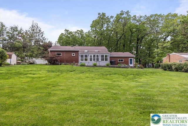 2840 Whitewood Rd, Hanover Twp, PA 18017 - back of property featuring a lawn and brick siding