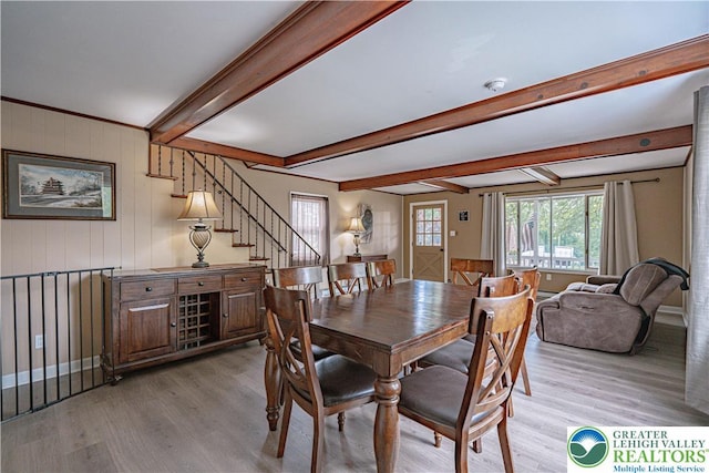 3082 Pricetown Rd, Pa, PA 19560 - dining area featuring light wood-style flooring, beam ceiling, and stairs