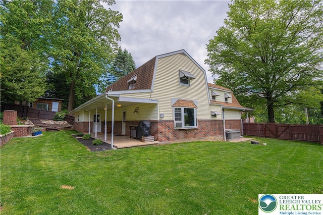 3082 Pricetown Rd, Pa, PA 19560 - back of property with a gambrel roof, brick siding, roof with shingles, and a patio area