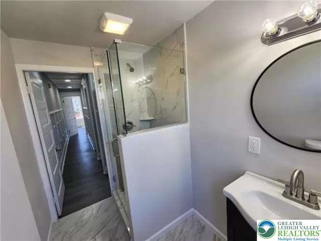944 S 24th St, Wilson Borough, PA 18042 - full bathroom featuring marble finish flooring, a stall shower, vanity, and baseboards