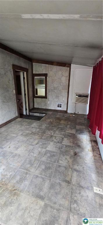 spare room featuring a wall mounted AC
