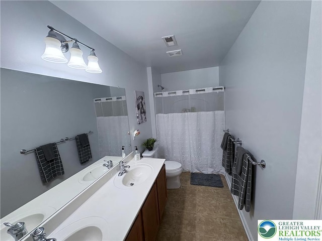 1557 Bridgeton Rd, Upper Macungie Twp, PA 18031 - full bathroom featuring a shower with shower curtain, toilet, and double vanity