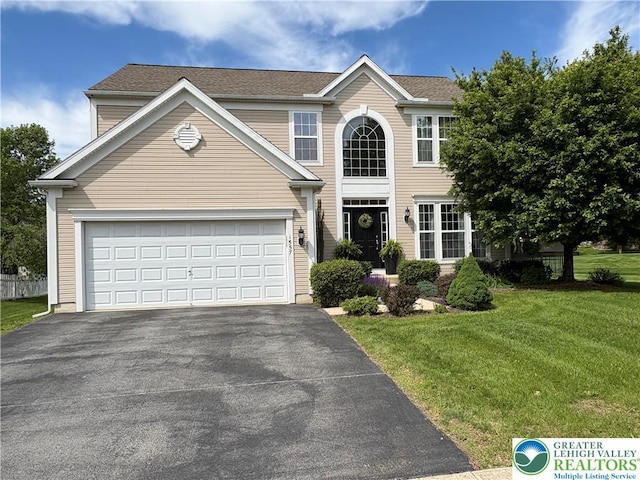 1557 Bridgeton Rd, Upper Macungie Twp, PA 18031 - view of front of home with asphalt driveway, a front lawn, and an attached garage