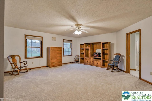 366 Winter Springs Rd, Bushkill Twp, PA 18064 - sitting room featuring light colored carpet, ceiling fan, baseboards, and a textured ceiling