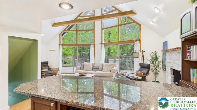 112 Moshannon Dr, Coolbaugh Twp, PA 18347 - living area with a fireplace, high vaulted ceiling, and healthy amount of natural light